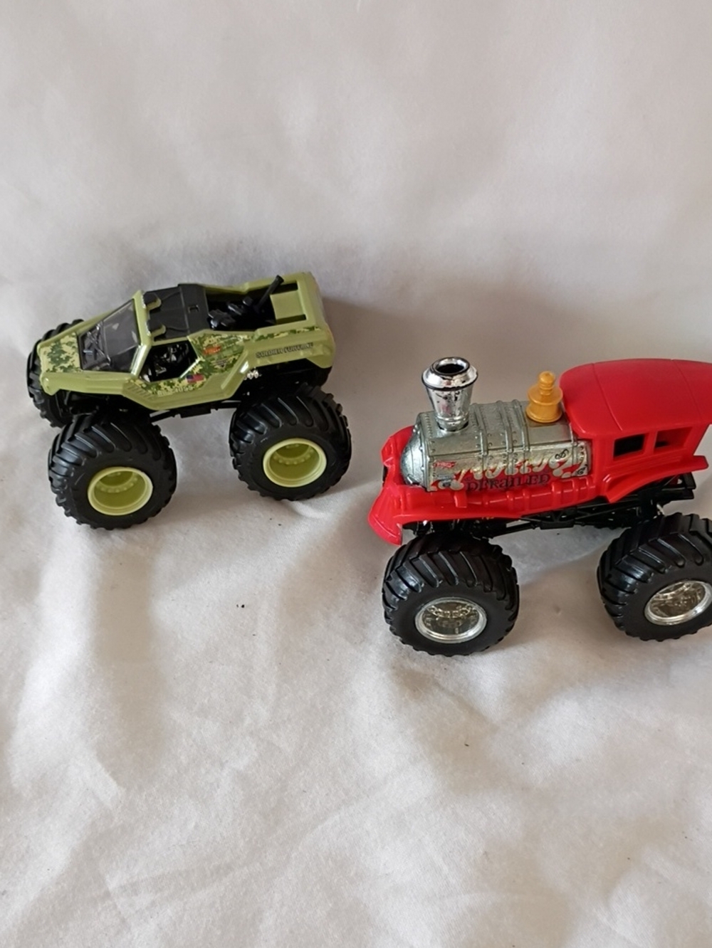 EUC Hot Wheels Monster Jam Soldier Fortune And Derailed Train Trucks Pair Of 2